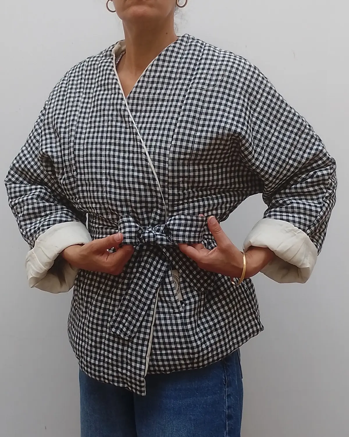 Reversible black and white gingham quilted jacket made from organic cotton